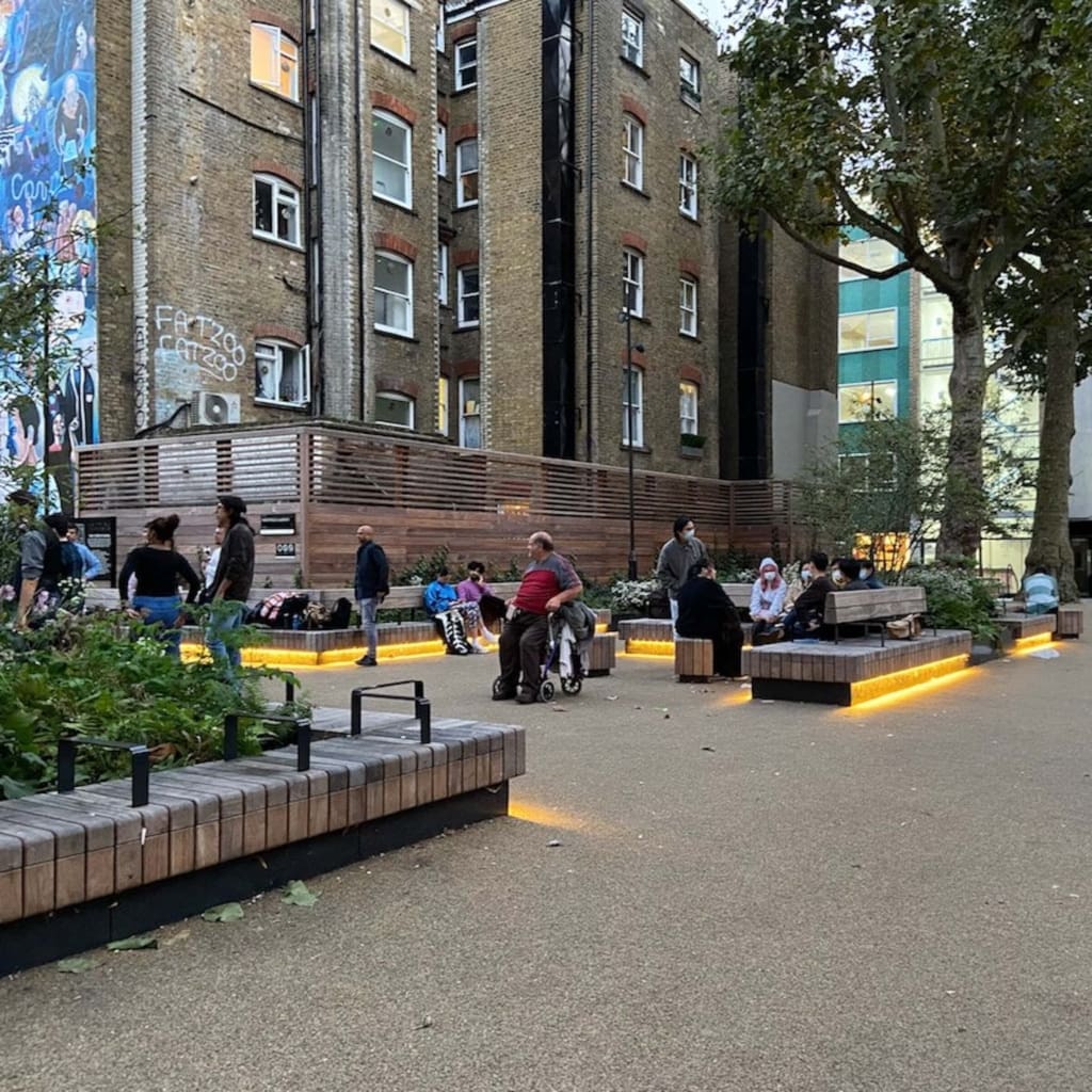 Warm white strip lighting under the seats offers a way finder to the benches and a gentle mood and vibe for hanging out in this public space. Photo credit: Rachel Bailey